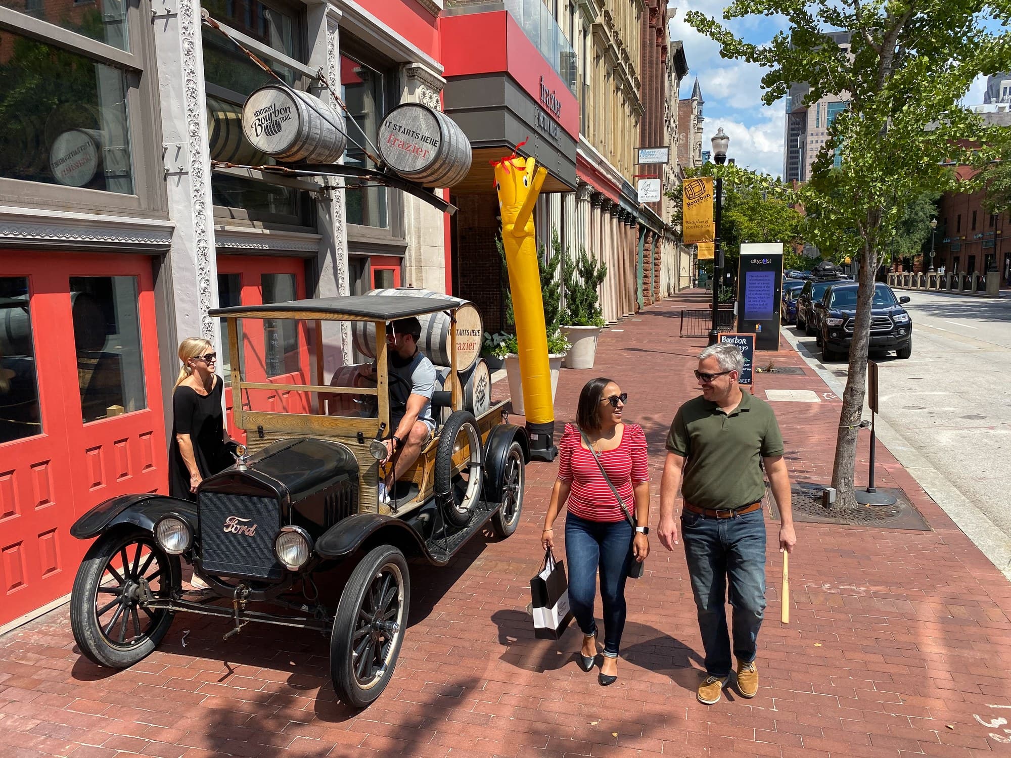 Travelers walking along Louisville's historic Main Street