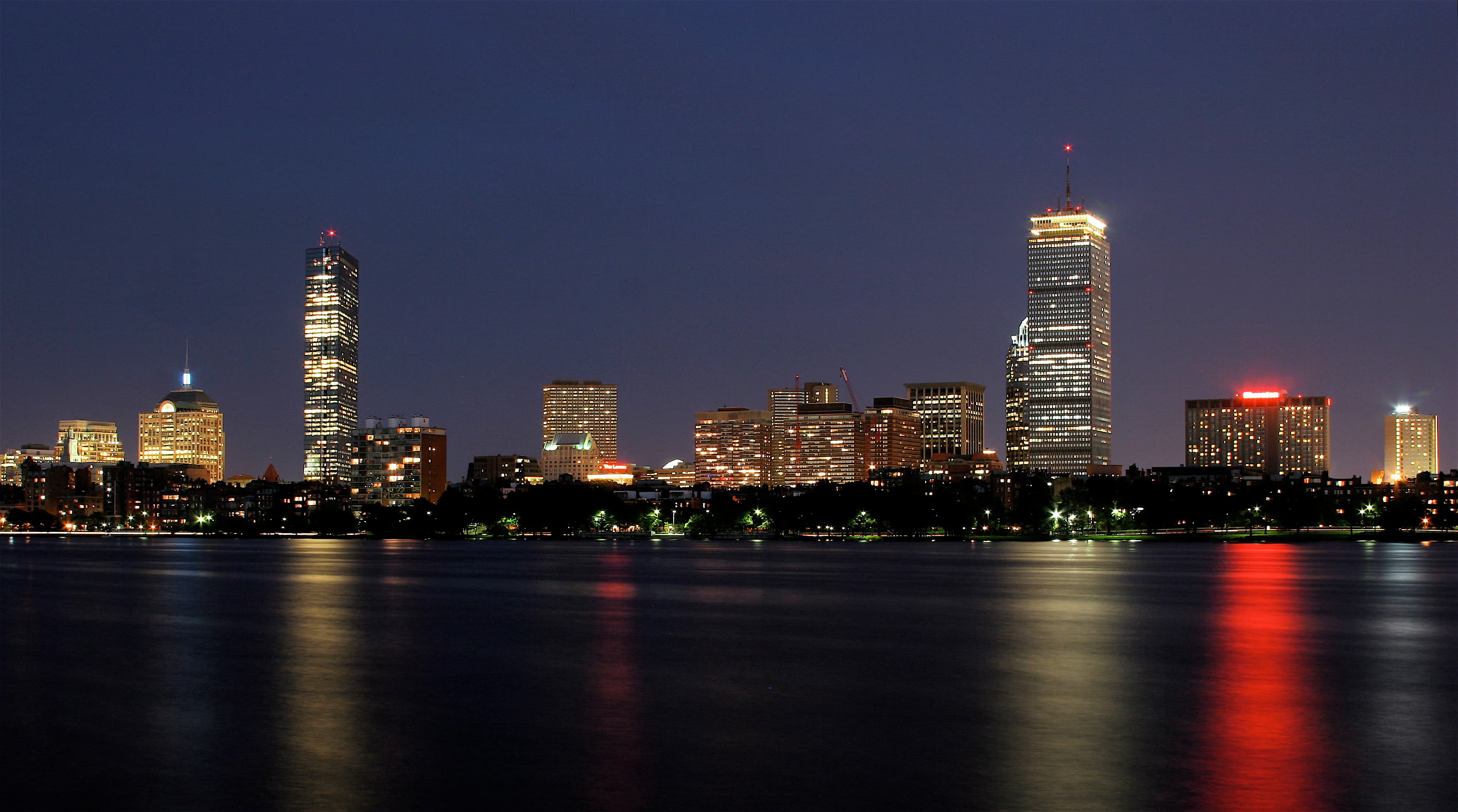 Boston skyline at night viewed across the Charles River from Cambridge