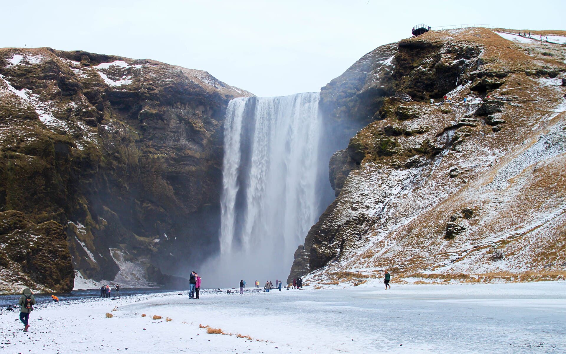 Skogafoss waterfall on the South Coast surrounded by winter snow