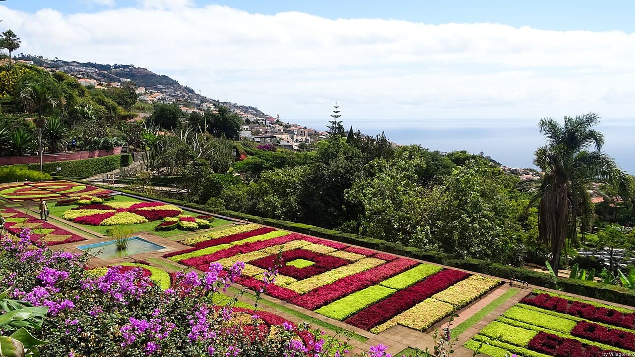 Colorful flower beds at Madeira Botanical Garden overlooking Funchal